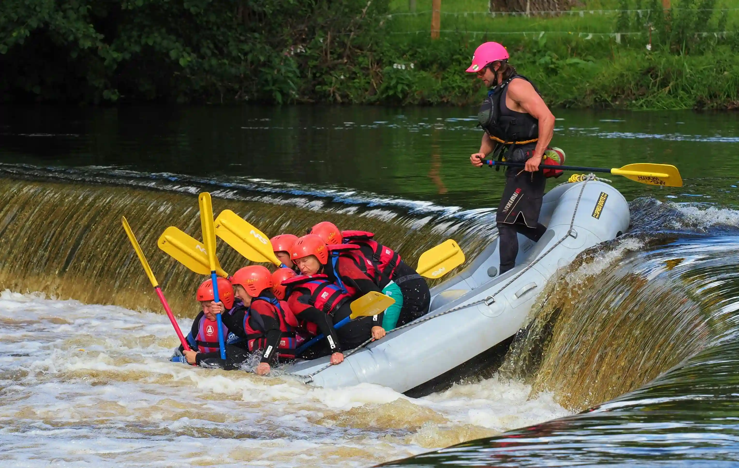 Rafting group celebrating after successfully navigating a difficult stretch of the Arkansas River.